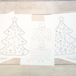 Printed Christmas tree and presents  drawing on white paper.